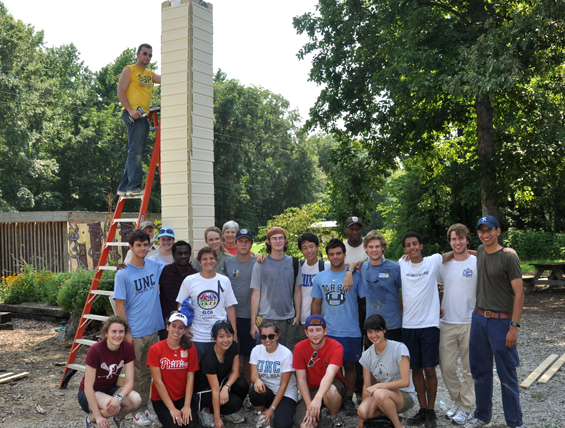Robertson Scholars in front of the chimney swift nesting habitat they constructed at the Dahomey Refuge. 